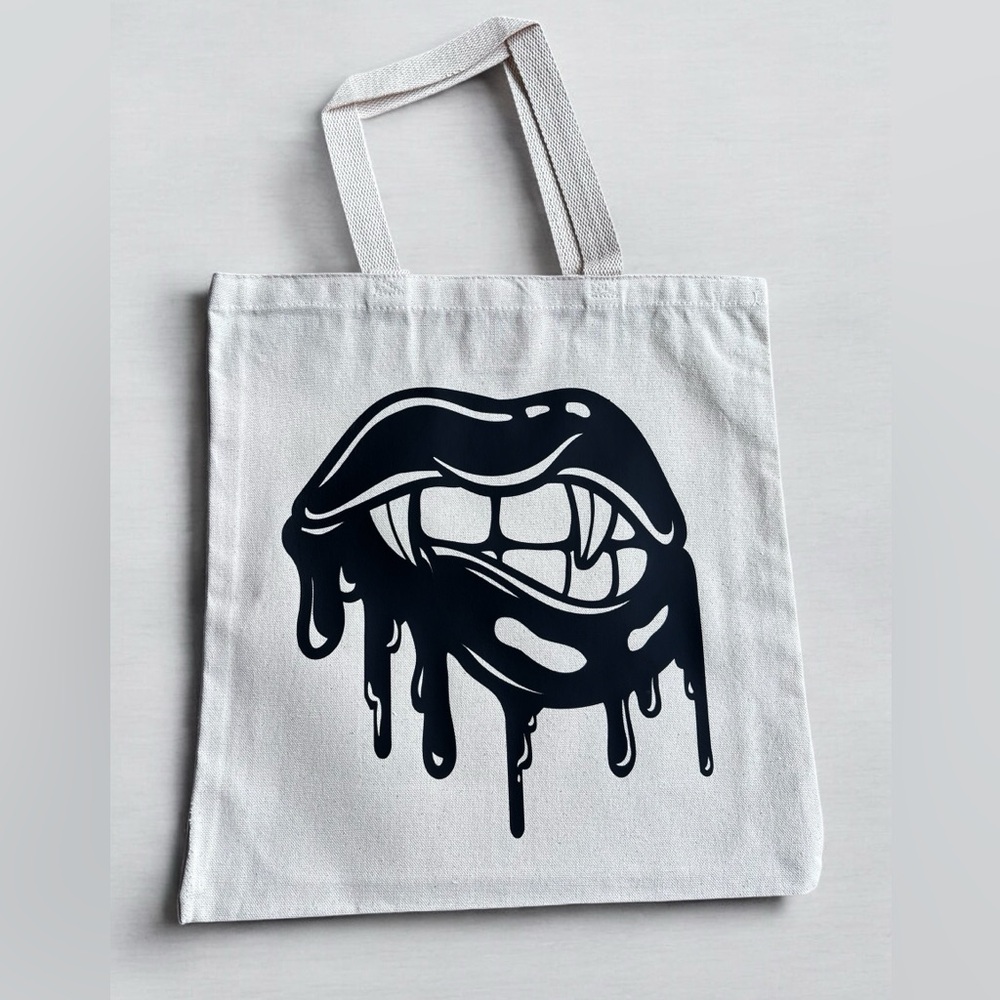 cotton tote bag with vampire kiss graphic